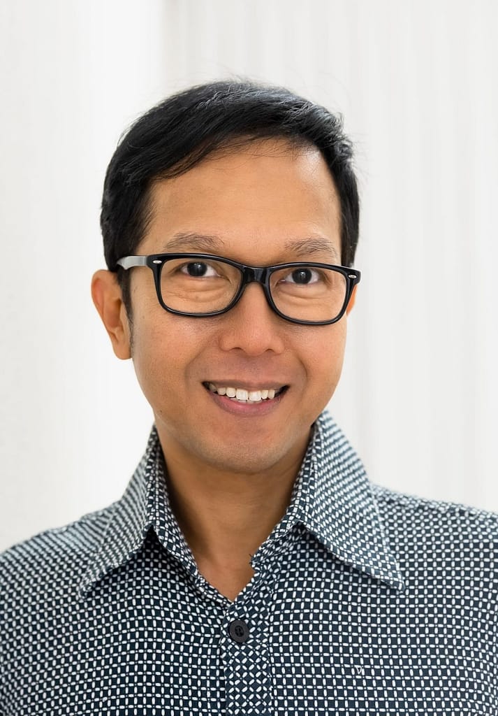 Porträtbild von Dr- med. Jimmy Masjkur - Endokrinologe und Diabetologe in der Praxis im Quartier in Winterthur.